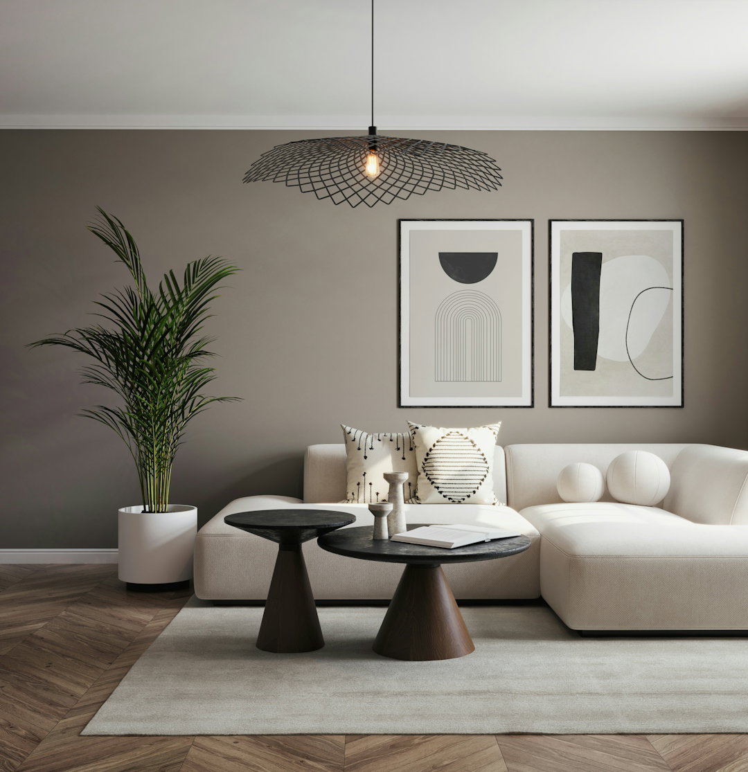 A living room with a white couch and a table